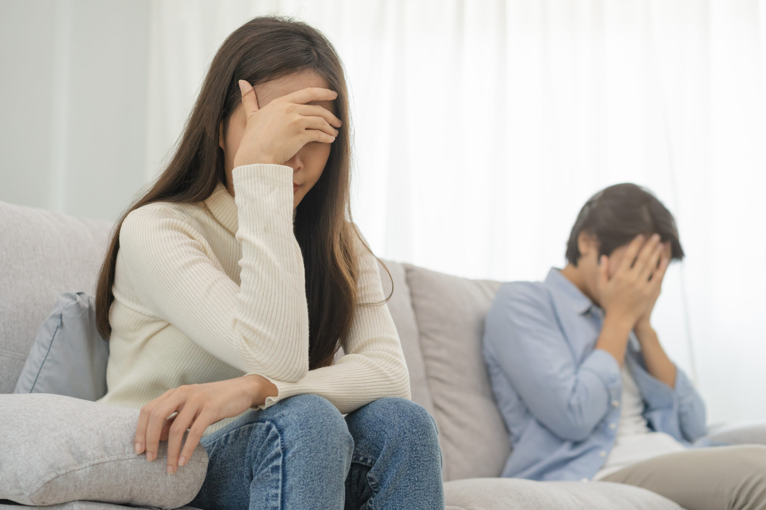 couple on a couch sad