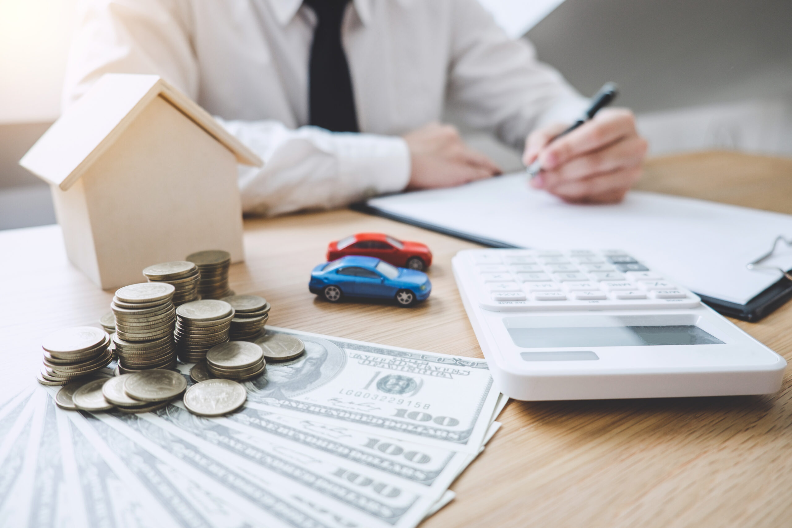 Business Financing Accounting Banking Concept, businessman doing finances and calculate about cost to real estate investment, Concept mortgage loan approval
