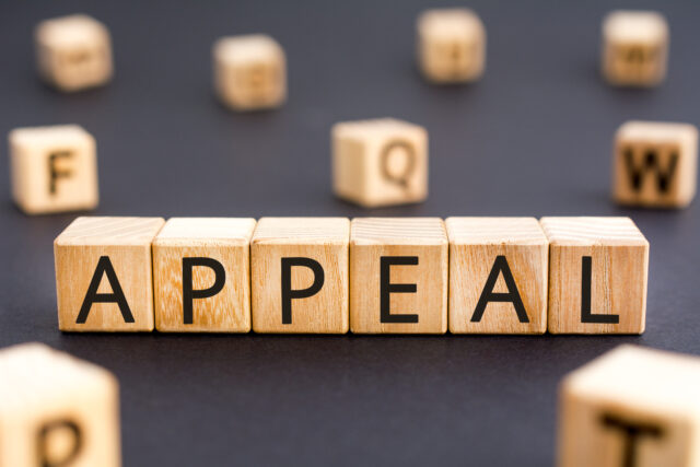 Appeal - word from wooden blocks with letters, urgent request appeal concept, random letters around white background